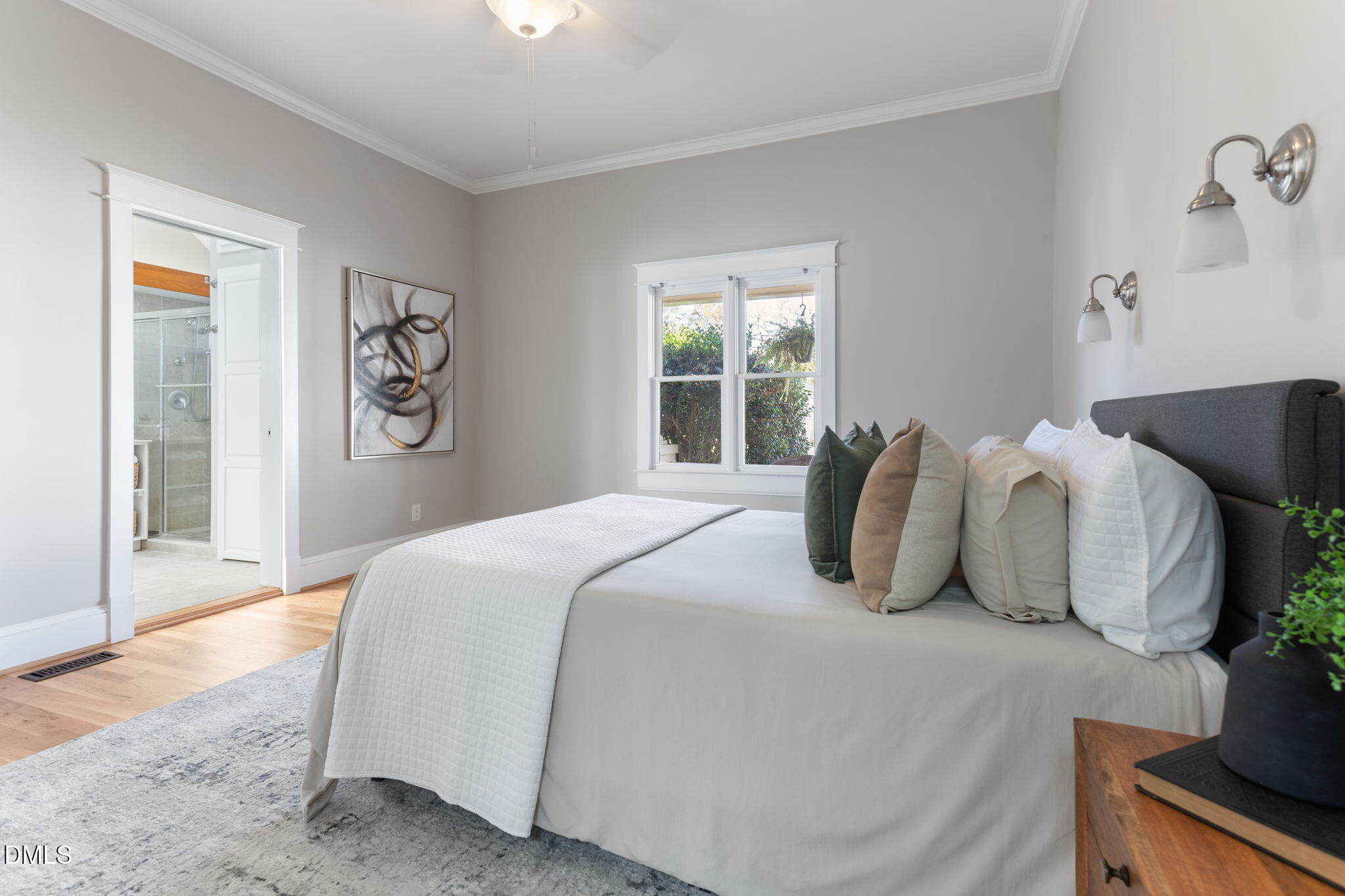 709 West North Street Raleigh, NC 27603 - Photo 17 of 42 a bedroom with bed and painting on the wall