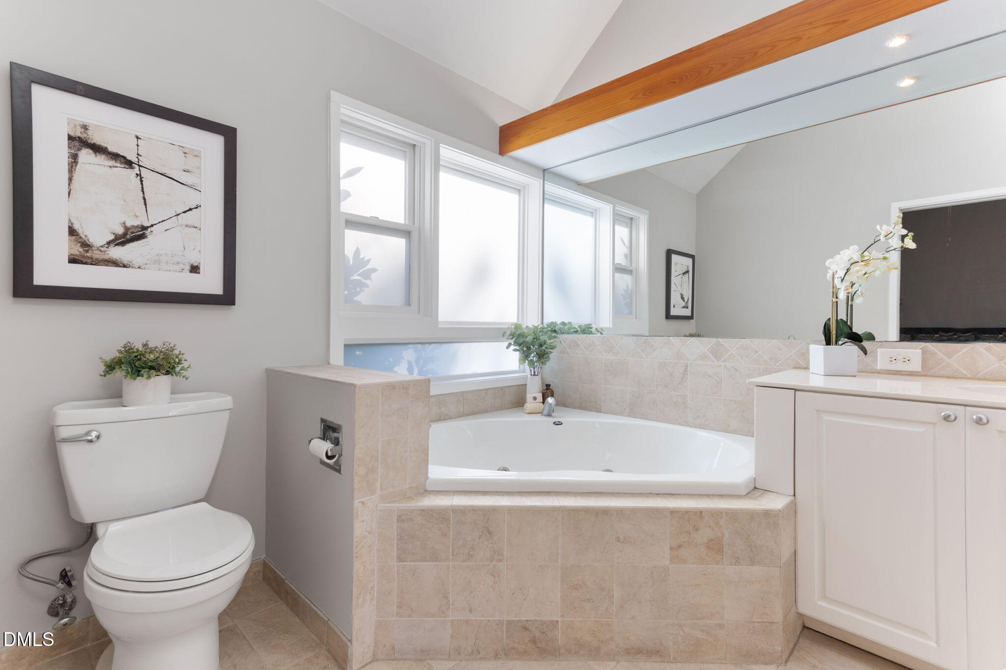 709 West North Street Raleigh, NC 27603 - Photo 20 of 42 a bathroom with a sink a mirror a toilet and a bathtub