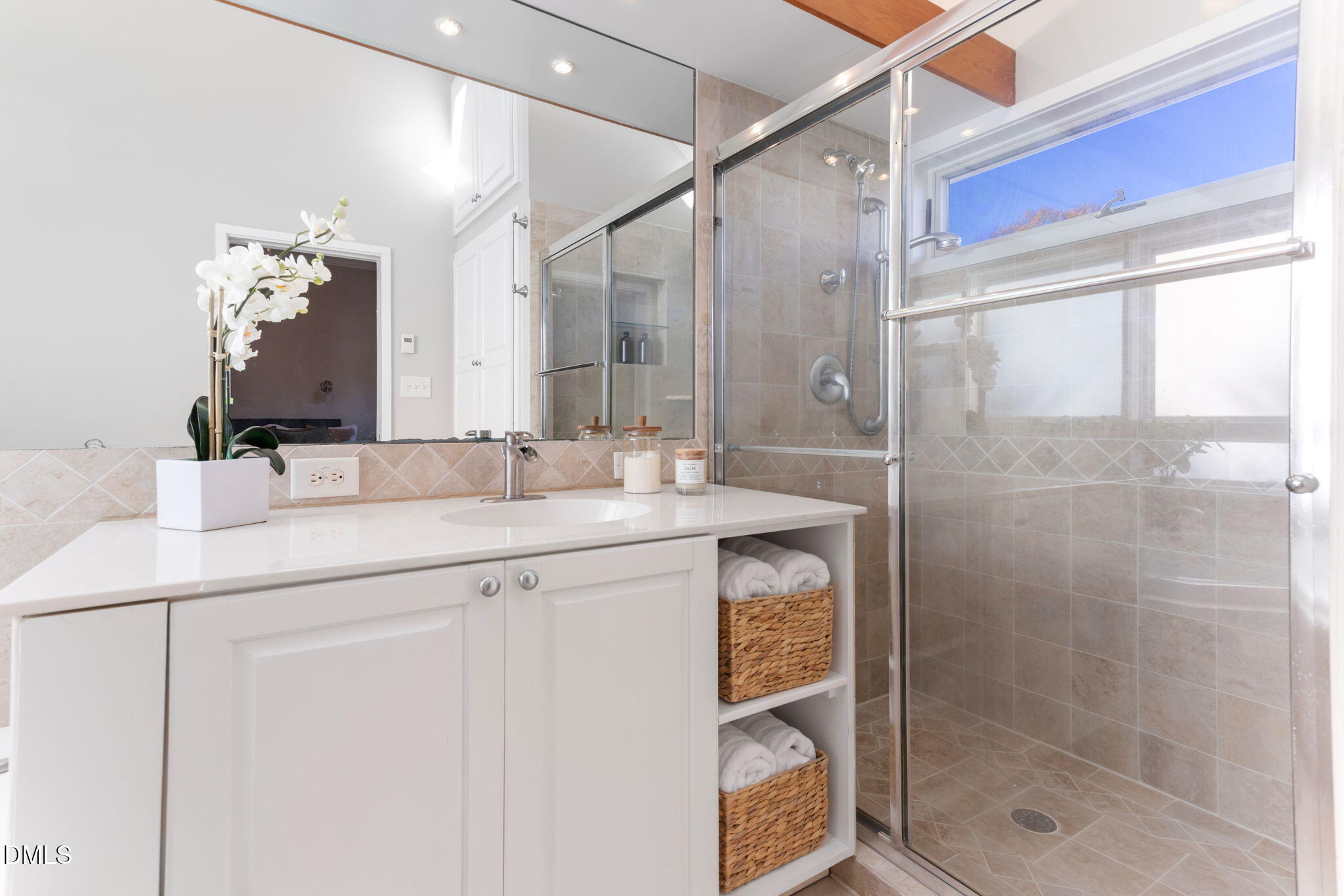 709 West North Street Raleigh, NC 27603 - Photo 23 of 42 a bathroom with a shower sink and mirror