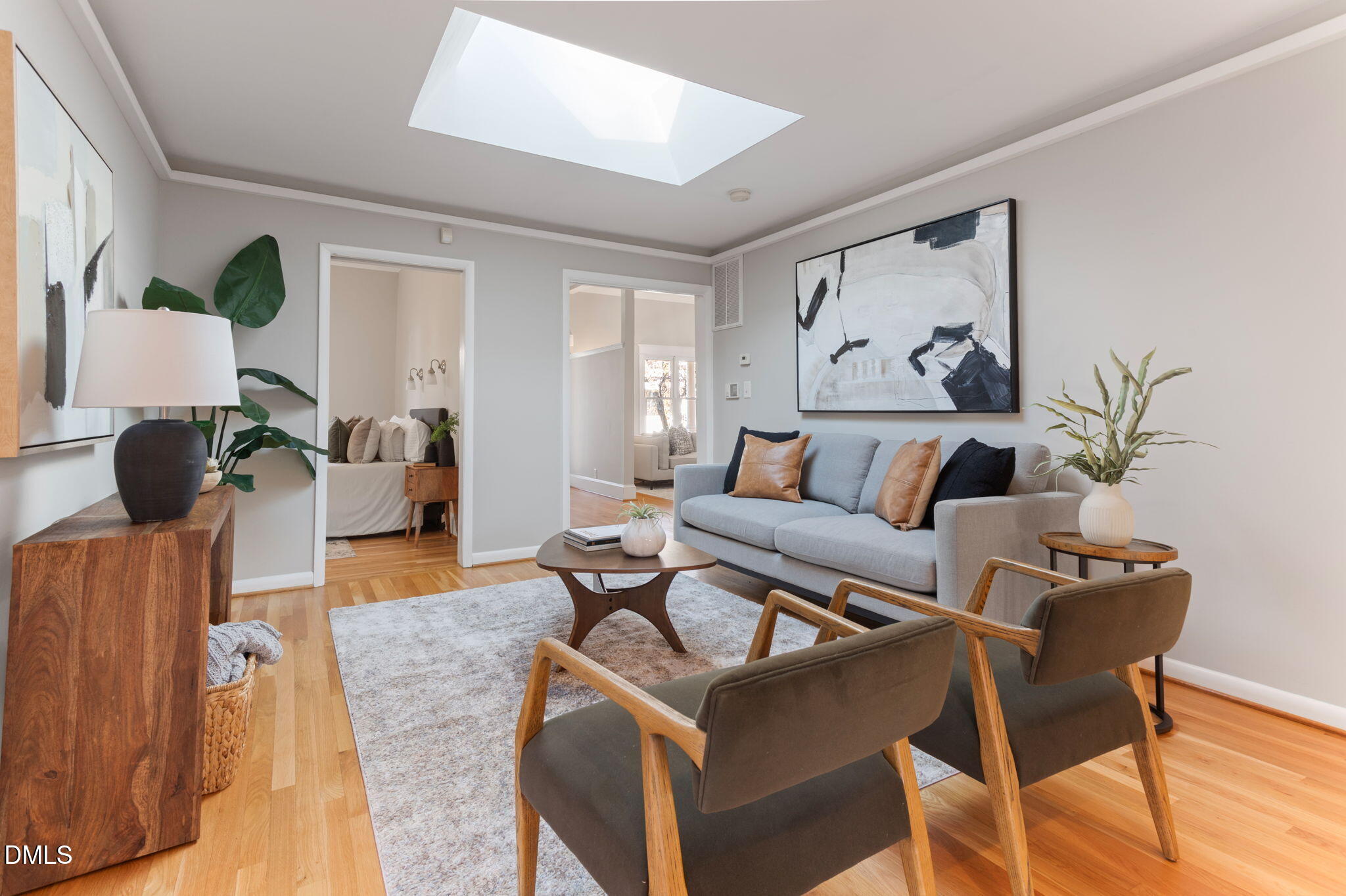 709 West North Street Raleigh, NC 27603 - Photo 25 of 42 a living room with furniture and a painting on the wall