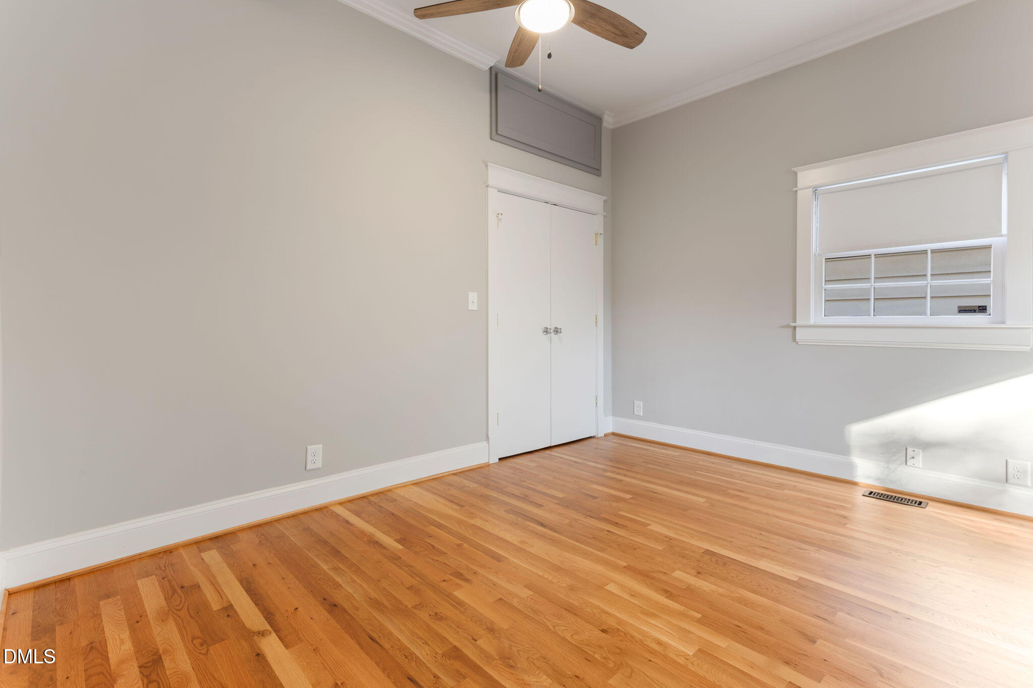 709 West North Street Raleigh, NC 27603 - Photo 27 of 42 a view of an empty room with window and chandelier fan