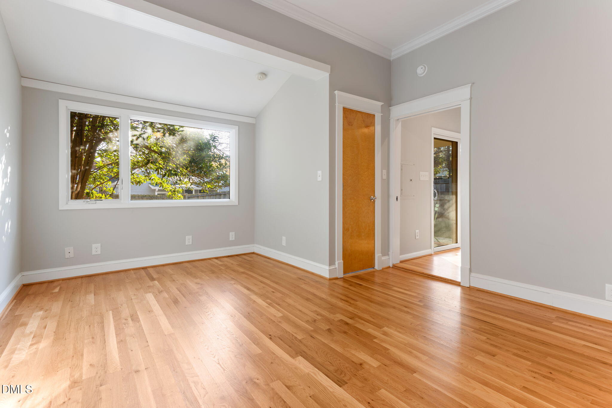 709 West North Street Raleigh, NC 27603 - Photo 28 of 42 an empty room with wooden floor and windows