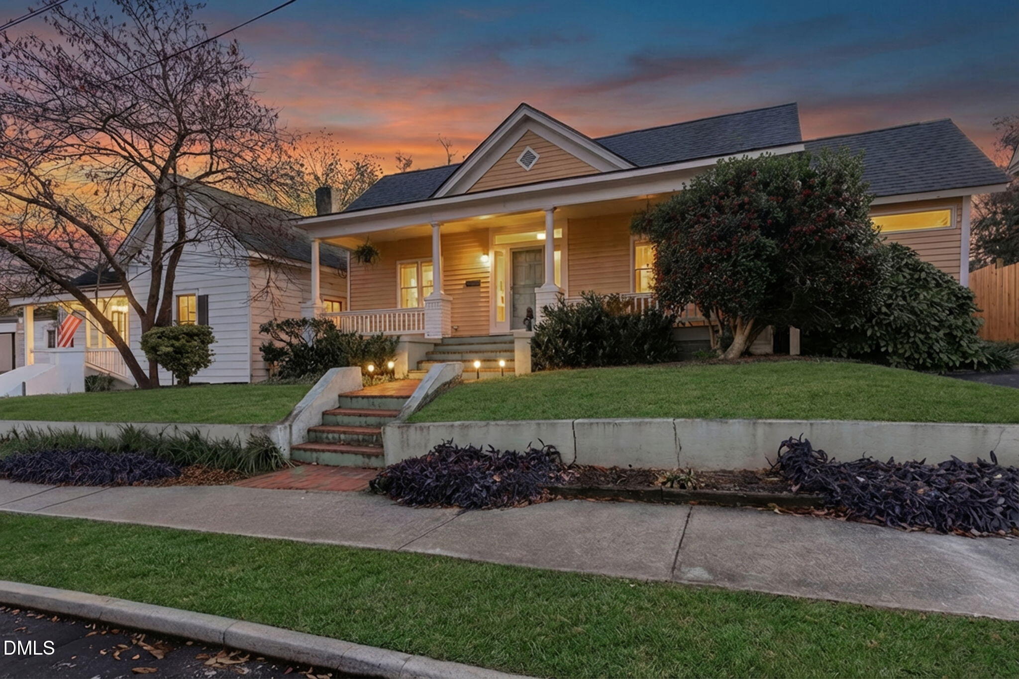 709 West North Street Raleigh, NC 27603 - Photo 2 of 42 a front view of a house with a garden