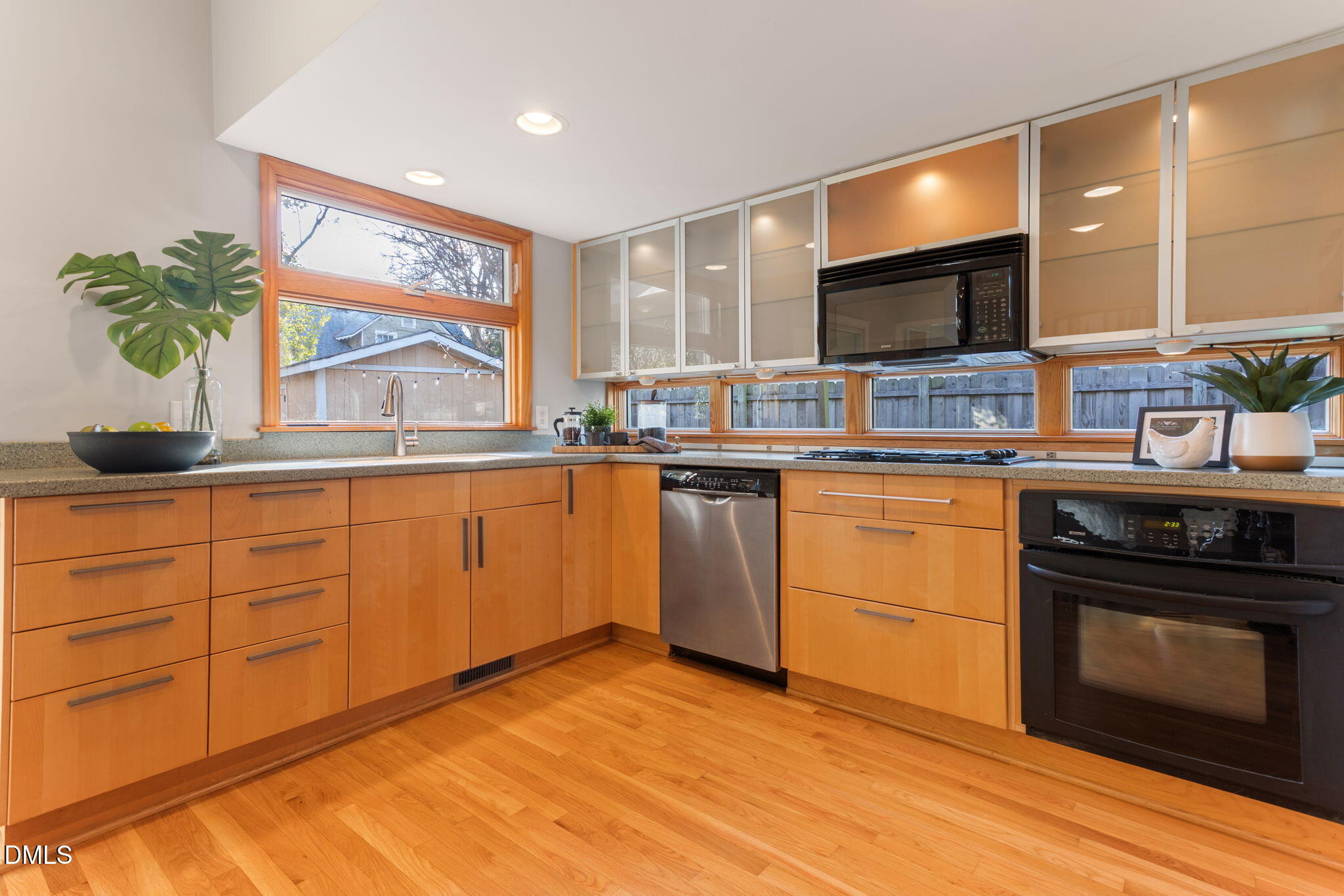 709 West North Street Raleigh, NC 27603 - Photo 6 of 42 a kitchen with a sink stove and cabinets