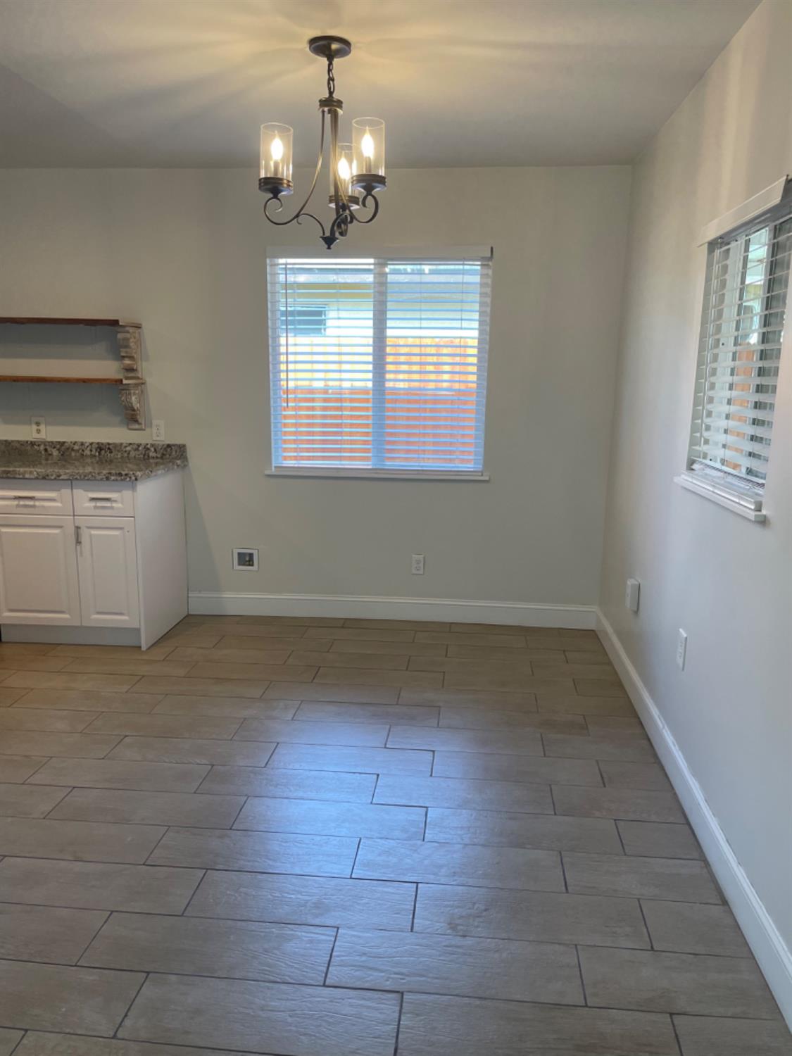 917 Davis Street Madera, CA 93638 - Photo 4 of 10 a view of a kitchen with marble kitchen and sink