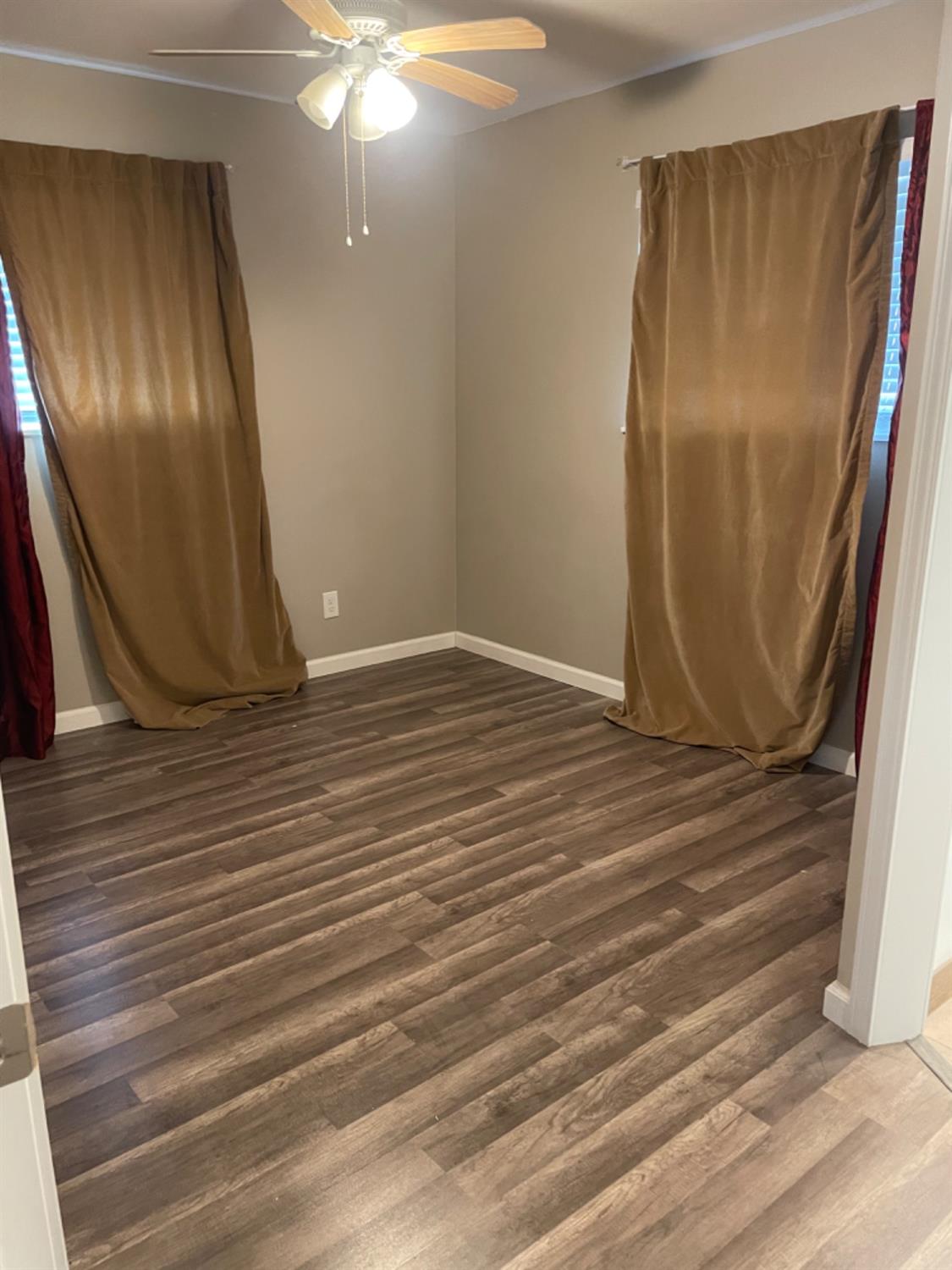 917 Davis Street Madera, CA 93638 - Photo 6 of 10 a view of a livingroom with wooden floor and staircase
