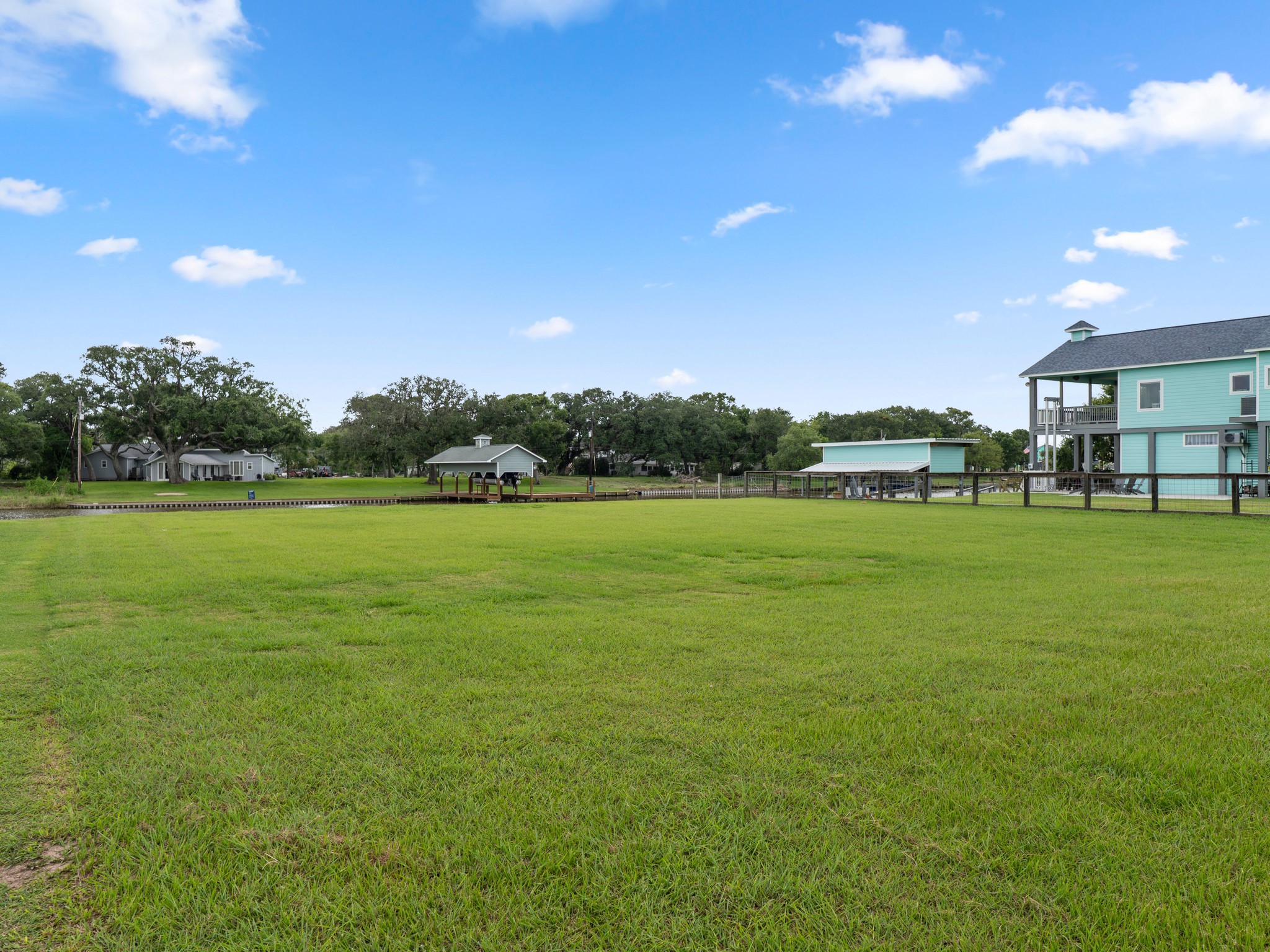 6 County Road 291 Sargent, TX 77414 - Photo 15 of 19 a view of a big yard with a house in the background