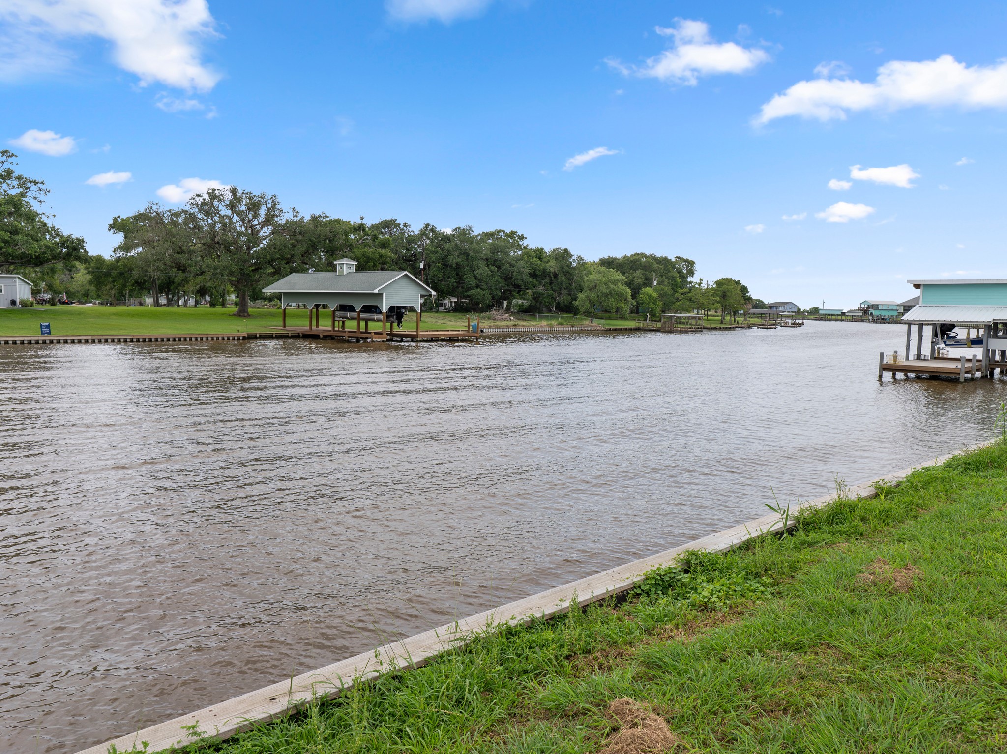 6 County Road 291 Sargent, TX 77414 - Photo 17 of 19 a view of a lake with houses in the back