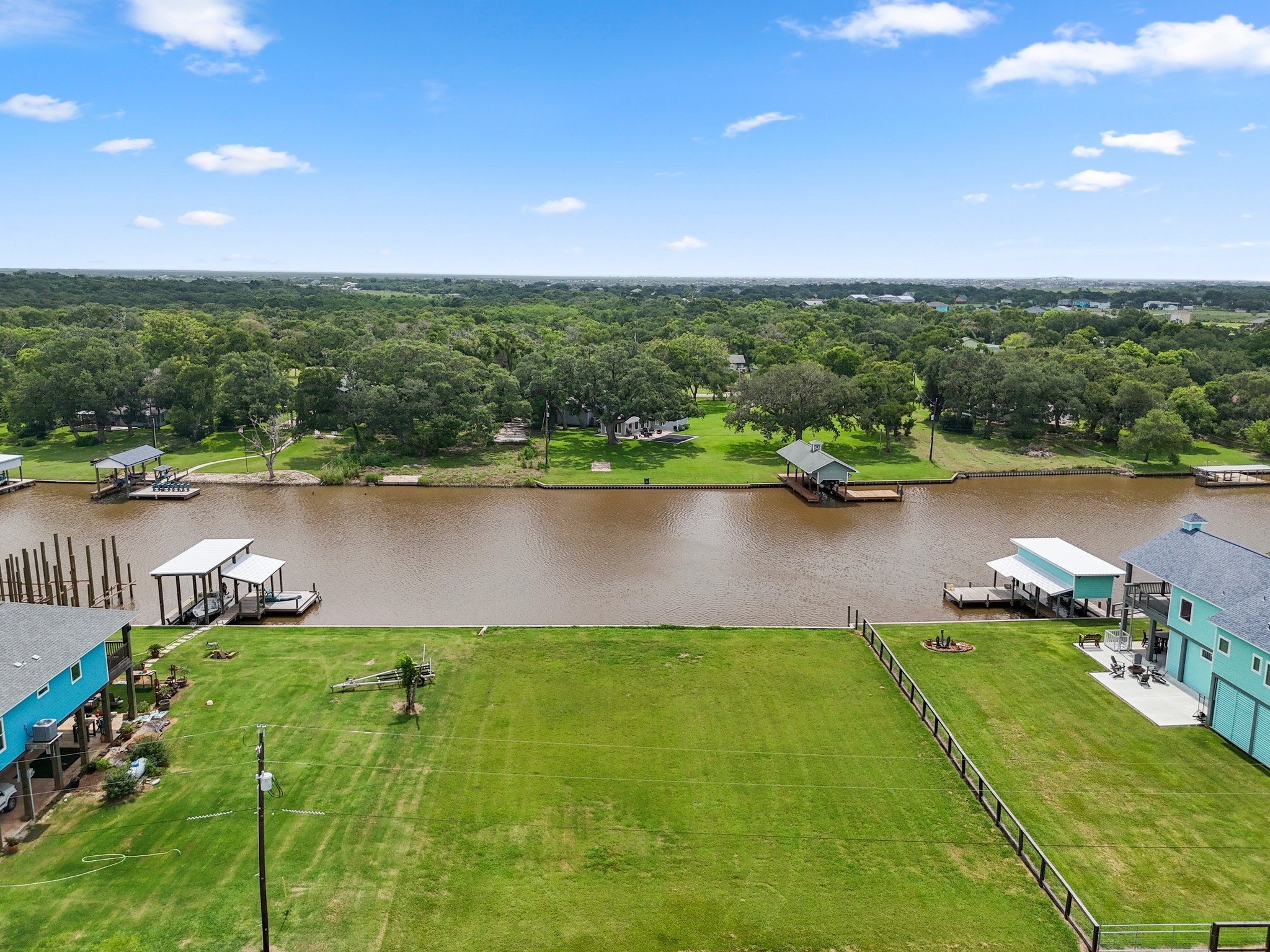 6 County Road 291 Sargent, TX 77414 - Photo 2 of 19 an aerial view of river residential houses with outdoor space and lake view
