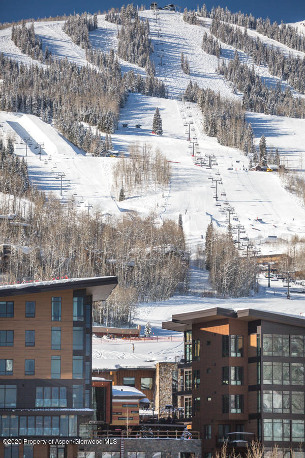 45 Wood Road, Unit 603 WEST Snowmass Village, CO 81615 - Photo 1 of 14 a view of building with an outdoor space