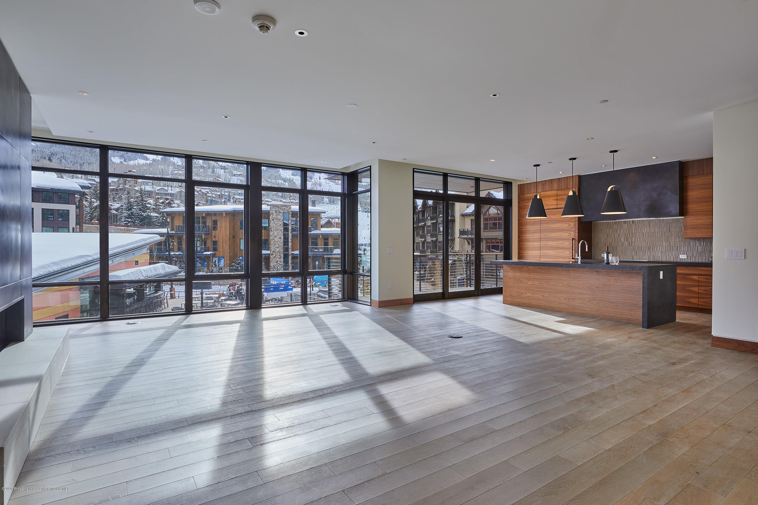 45 Wood Road, Unit 603 WEST Snowmass Village, CO 81615 - Photo 3 of 14 a large hall with a large window and furniture