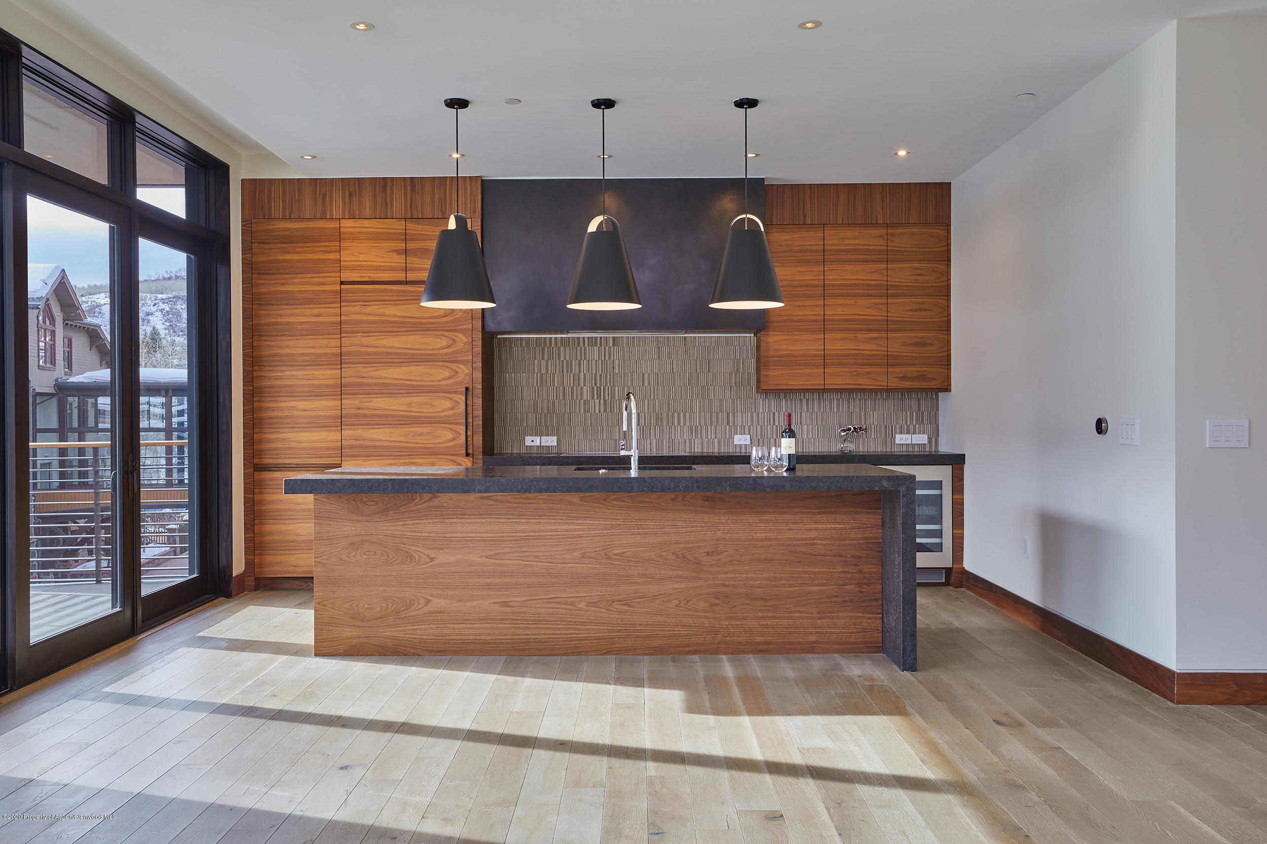 45 Wood Road, Unit 603 WEST Snowmass Village, CO 81615 - Photo 4 of 14 wooden floor with kitchen view