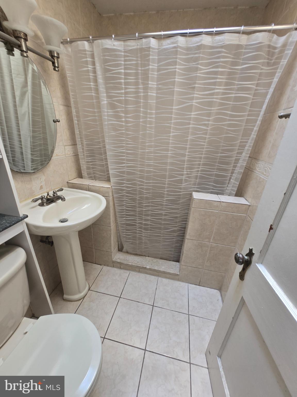 6347 Jackson Street Philadelphia, PA 19135 - Photo 6 of 11 Charming bathroom with modern fixtures.