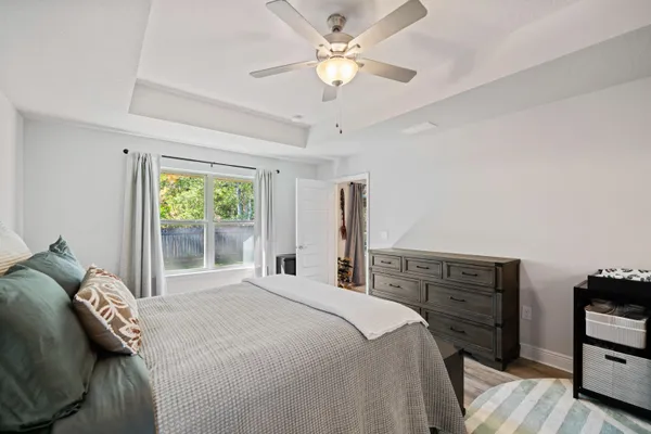 a bedroom with a bed and a tv