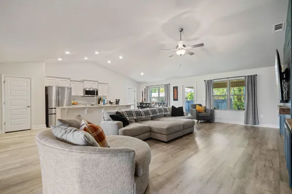 a living room with furniture white walls and white walls