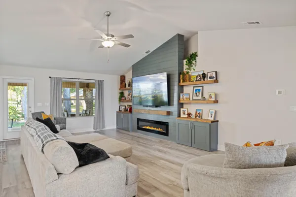 a living room with furniture and a flat screen tv