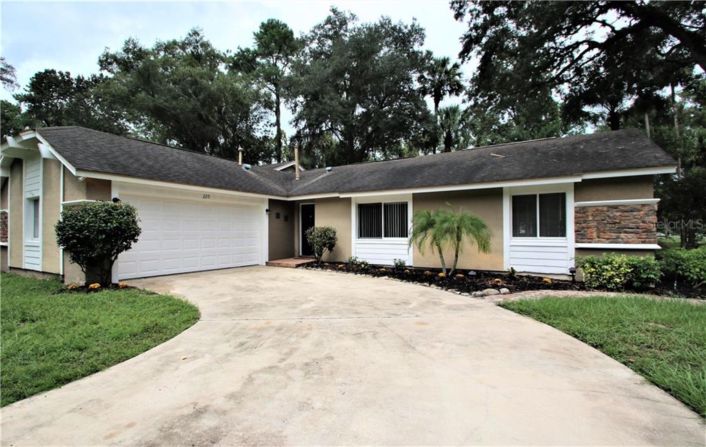 220 Oak Road Winter Springs, FL 32708 - Photo 1 of 1 Nice long curved driveway into your side garage entry 2 car garage