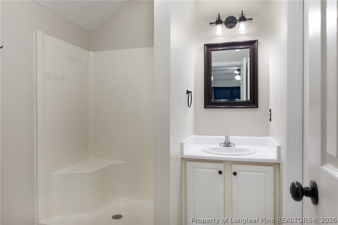 310 Timberidge Drive Raeford, NC 28376 - Photo 26 of 30 a bathroom with a sink and a mirror
