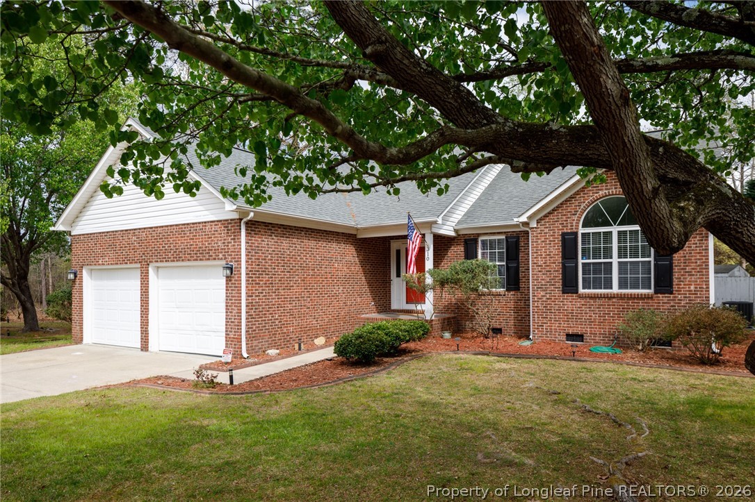 310 Timberidge Drive Raeford, NC 28376 - Photo 3 of 30 a front view of a house with garden