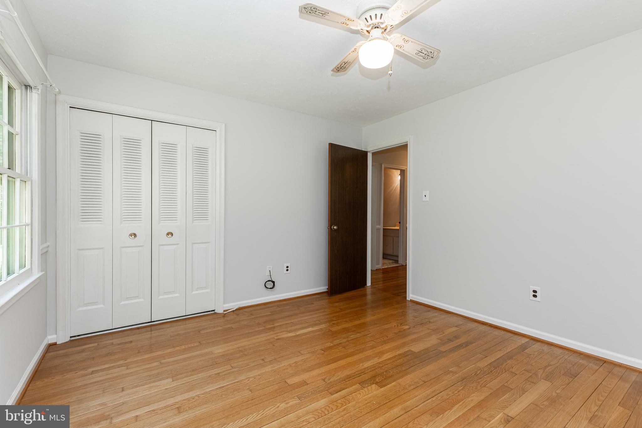 6550 Tip Hill Drive La Plata, MD 20646 - Photo 14 of 24 a view of an empty room with wooden floor and a window