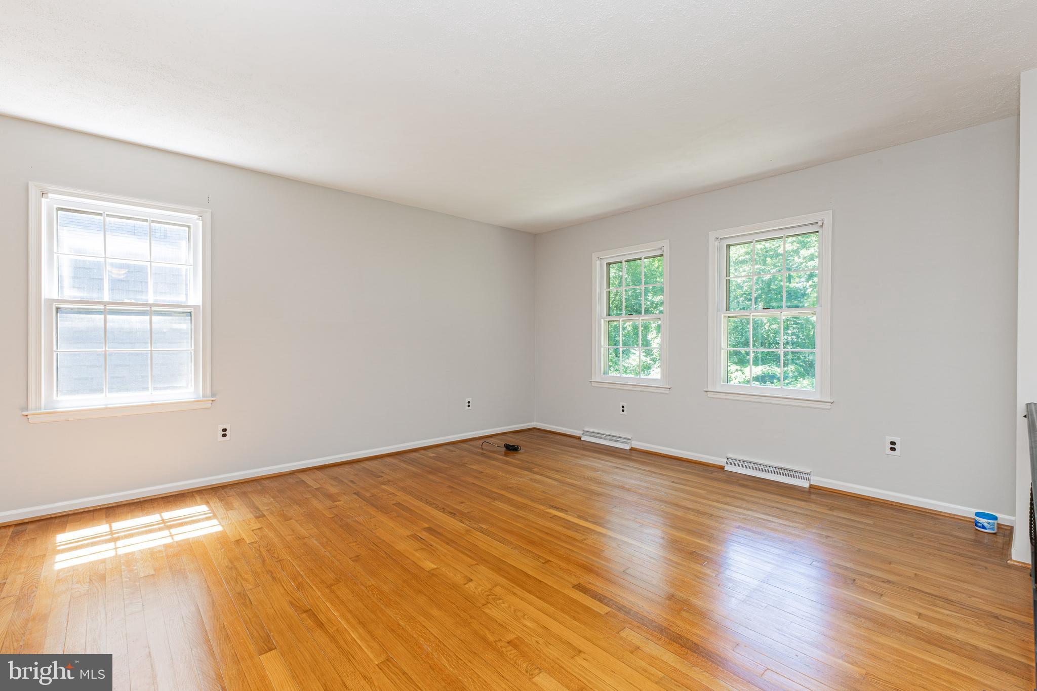 6550 Tip Hill Drive La Plata, MD 20646 - Photo 3 of 24 a view of an empty room with wooden floor and a window