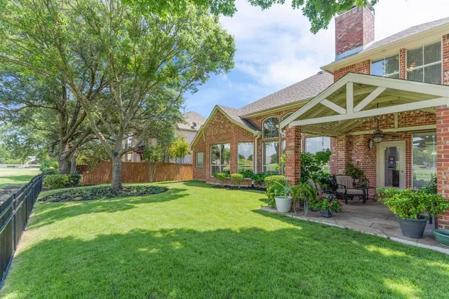 a view of a house with a yard porch and sitting area