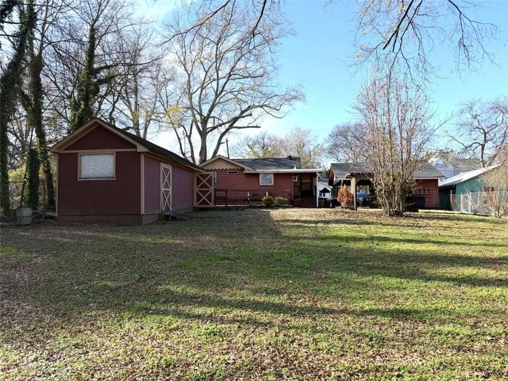 421 Cedar Avenue Southwest Rome, GA 30161 - Photo 20 of 26 a view of a house with a yard covered with snow