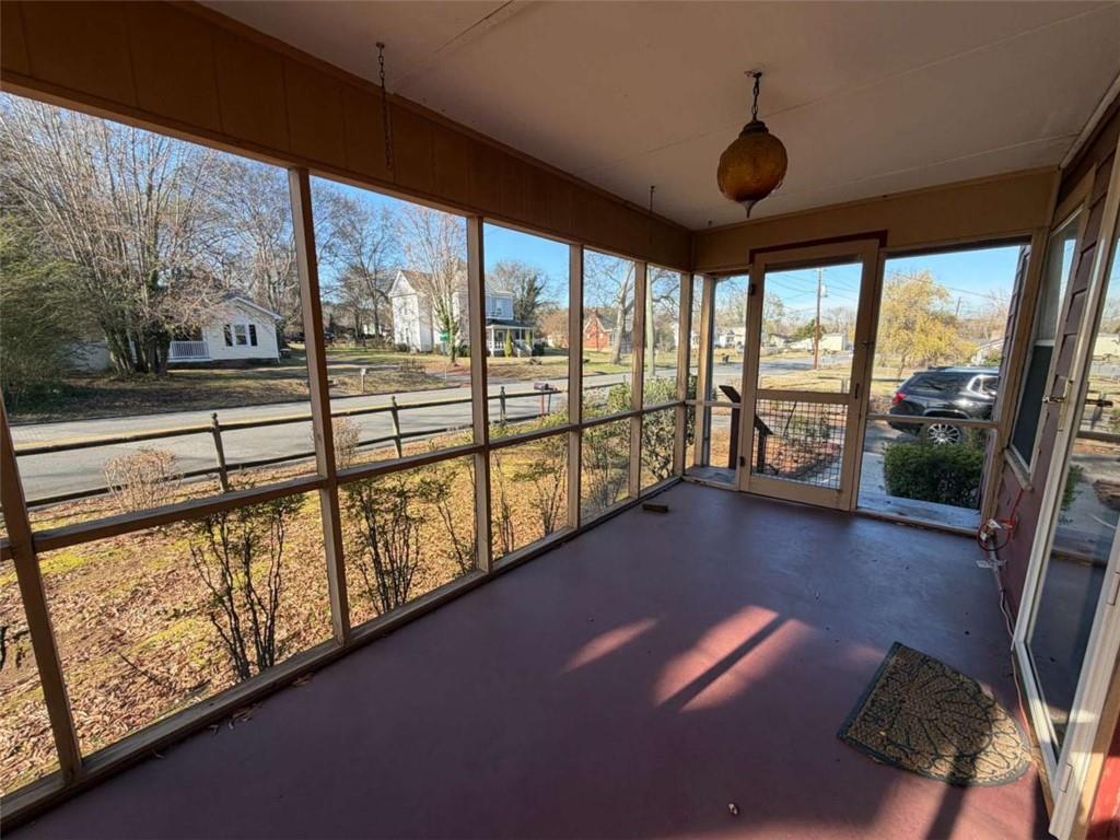 421 Cedar Avenue Southwest Rome, GA 30161 - Photo 2 of 26 a view of an empty room with wooden floor and furniture