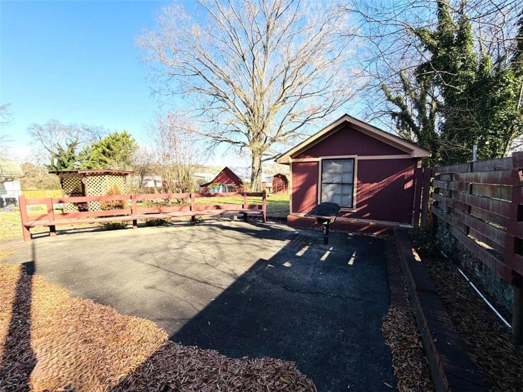 421 Cedar Avenue Southwest Rome, GA 30161 - Photo 24 of 26 a view of a house with a yard covered in snow