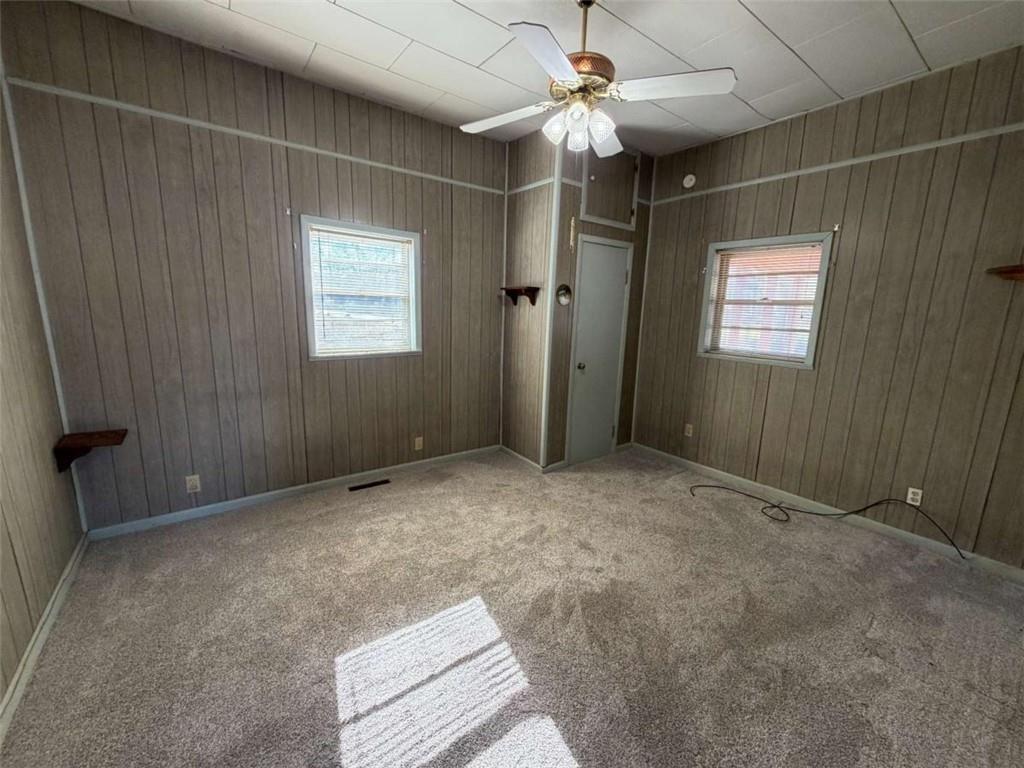 421 Cedar Avenue Southwest Rome, GA 30161 - Photo 8 of 26 en empty room with windows and fan