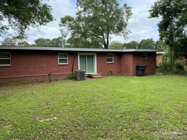 a backyard of a house with lots of green space