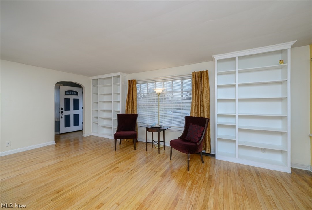 241 Everhard Road Southwest North Canton, OH 44709 - Photo 4 of 21 Living room featuring built-in book shelves