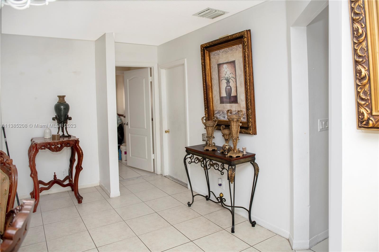11331 Rockinghorse Road Cooper City, FL 33026 - Photo 5 of 10 a view of a room with a table and chairs