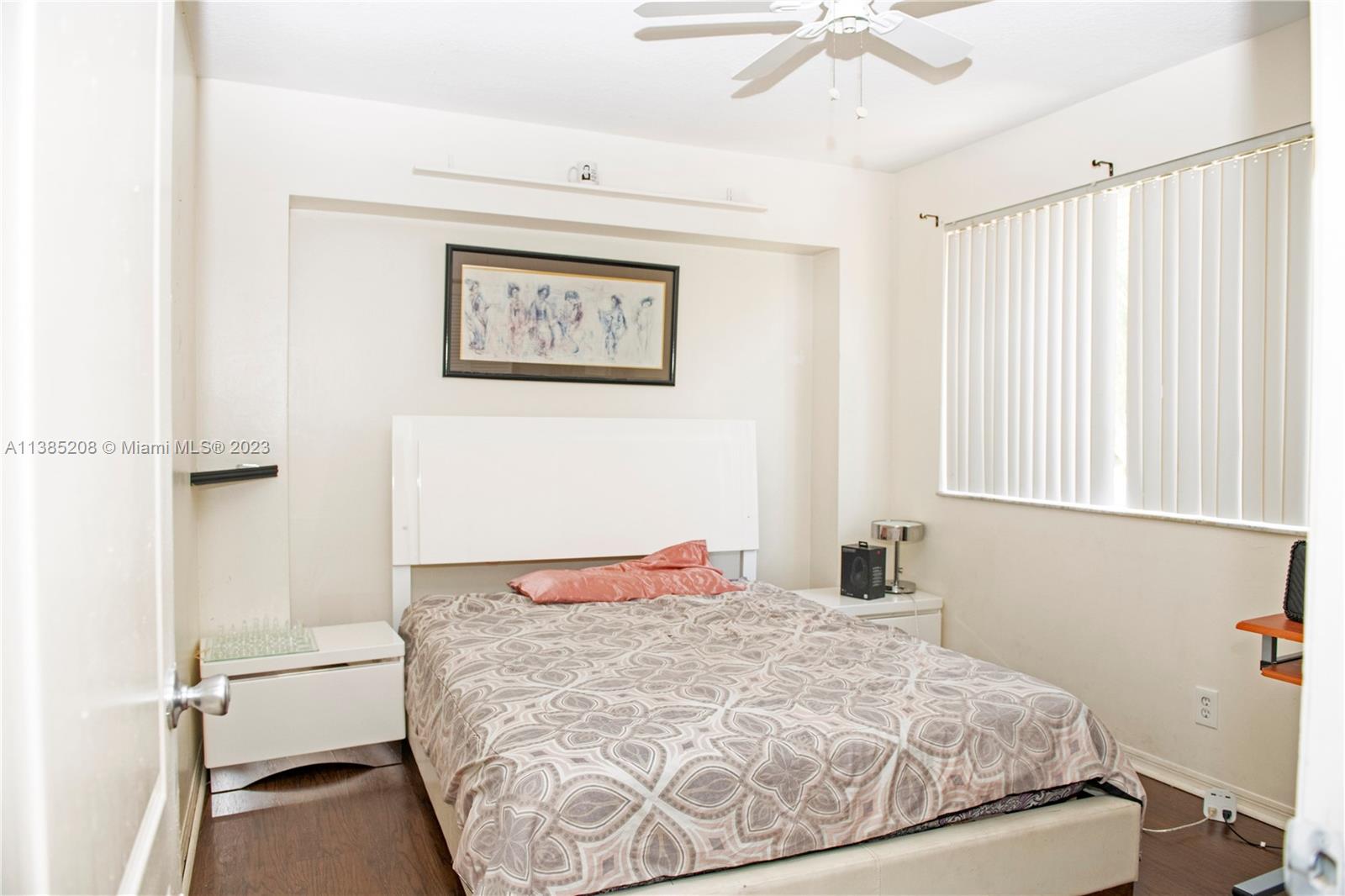 11331 Rockinghorse Road Cooper City, FL 33026 - Photo 9 of 10 a bedroom with a bed and a window