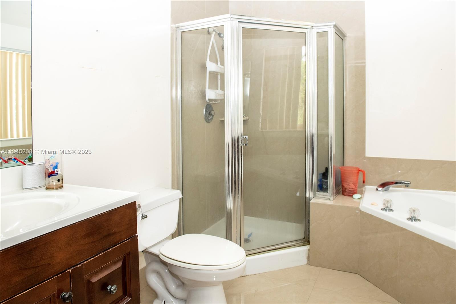 11331 Rockinghorse Road Cooper City, FL 33026 - Photo 10 of 10 a bathroom with a sink toilet and shower