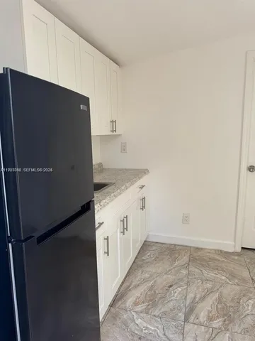 a view of a utility room with closet