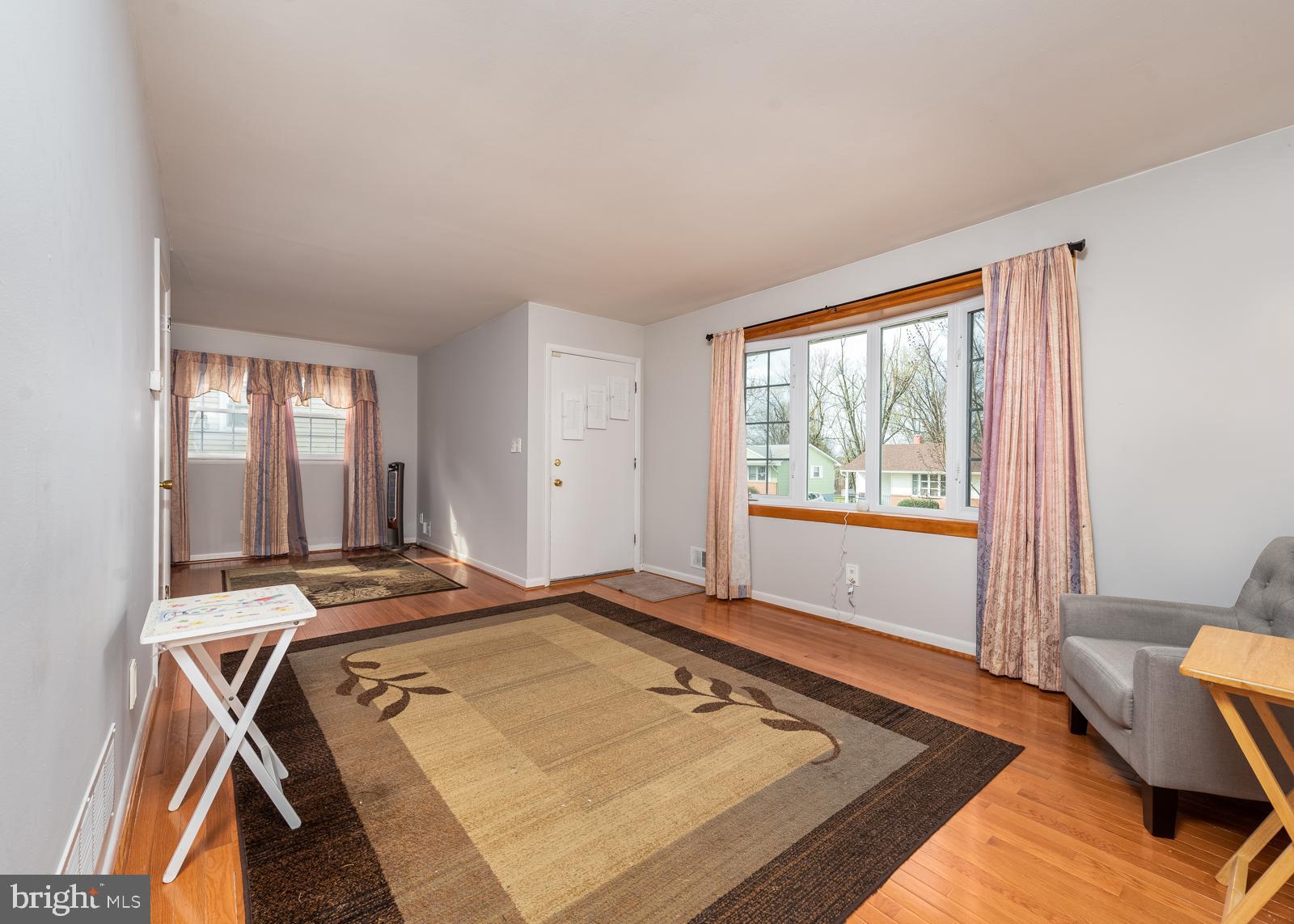 6830 Richardson Road Baltimore, MD 21207 - Photo 2 of 22 Large living room with hardwoods