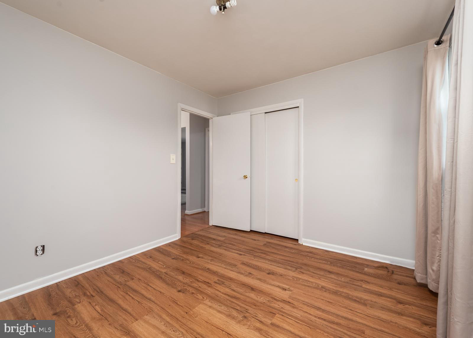 6830 Richardson Road Baltimore, MD 21207 - Photo 5 of 22 Bedroom 1 with hardwood floors main level