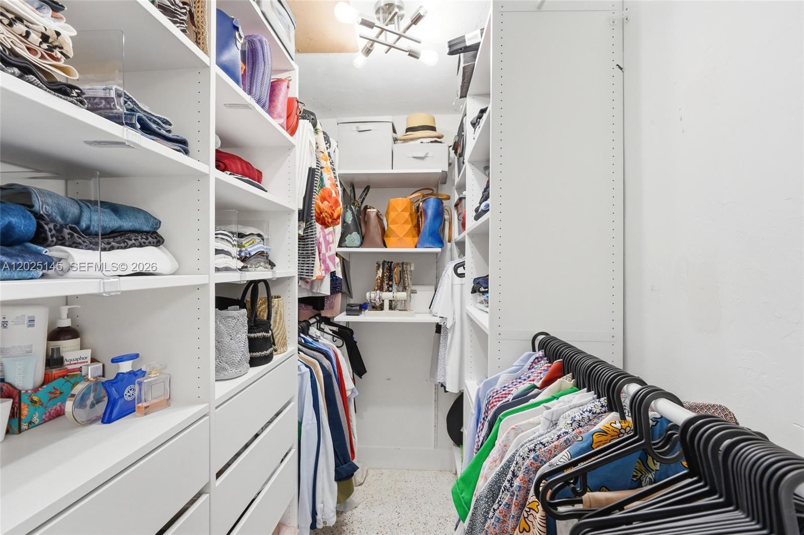 3101 Southwest 25th Terrace Miami, FL 33133 - Photo 16 of 31 a view of walk in closet with clothes and shoes