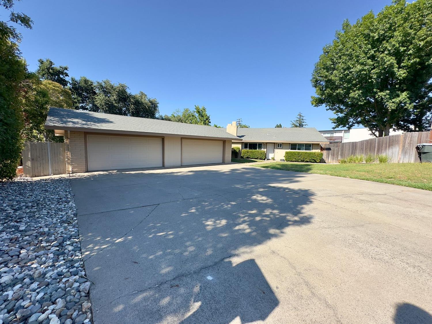 5743 Haskell Avenue Carmichael, CA 95608 - Photo 1 of 47 a front view of a house with a yard and trees