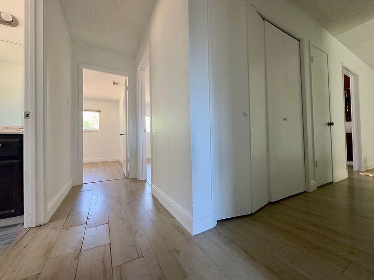 5743 Haskell Avenue Carmichael, CA 95608 - Photo 11 of 47 a view of a hallway with wooden floor