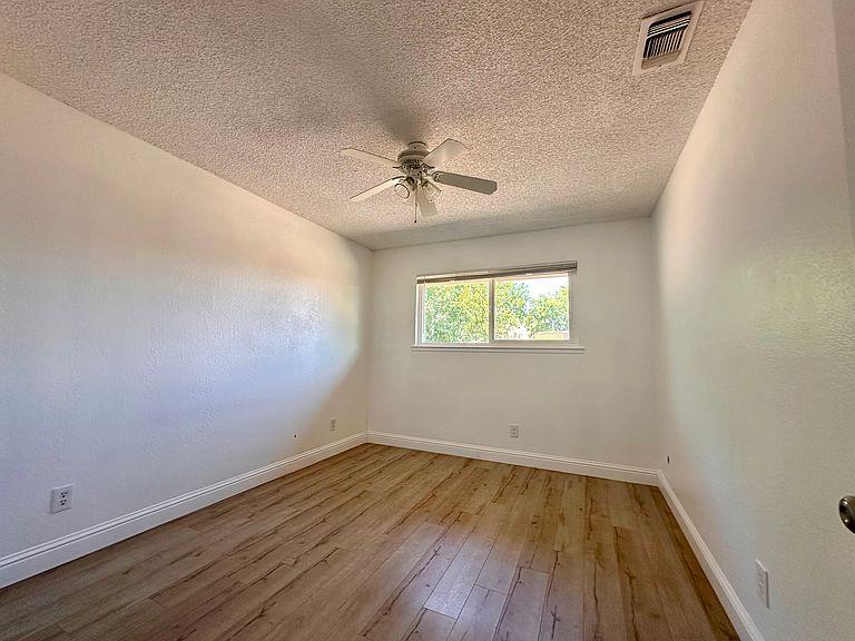 5743 Haskell Avenue Carmichael, CA 95608 - Photo 16 of 47 wooden floor in an empty room with a window