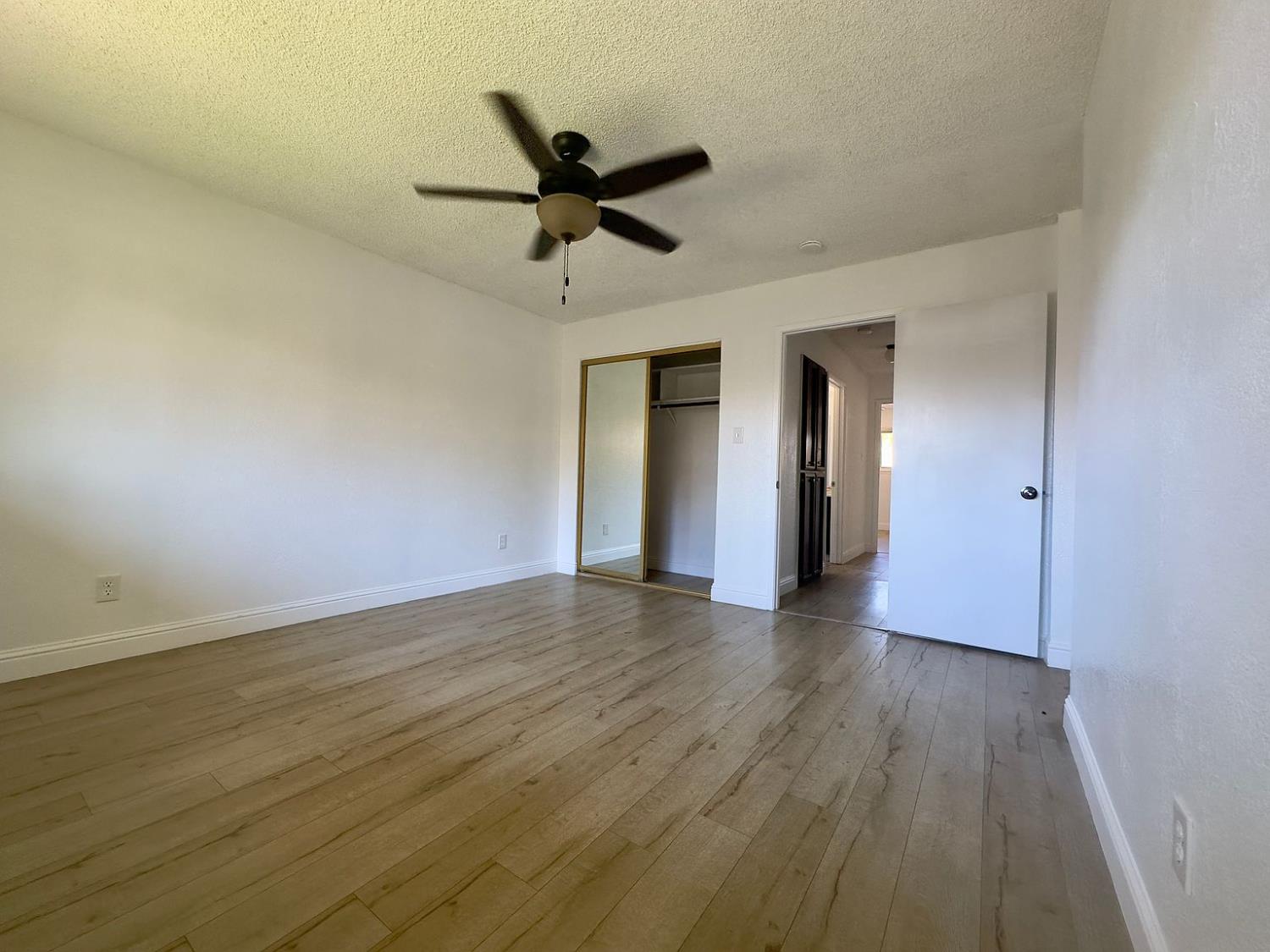 5743 Haskell Avenue Carmichael, CA 95608 - Photo 18 of 47 a view of a livingroom with wooden floor and a ceiling fan