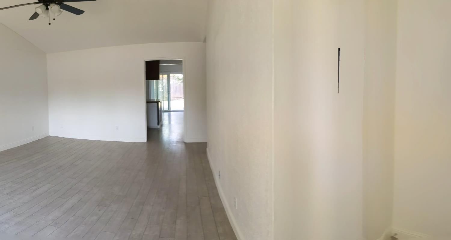 5743 Haskell Avenue Carmichael, CA 95608 - Photo 30 of 47 a view of a livingroom with wooden floor and a ceiling fan