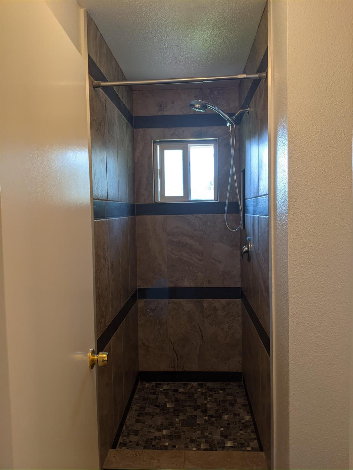 5743 Haskell Avenue Carmichael, CA 95608 - Photo 43 of 47 a bathroom with a glass door shower