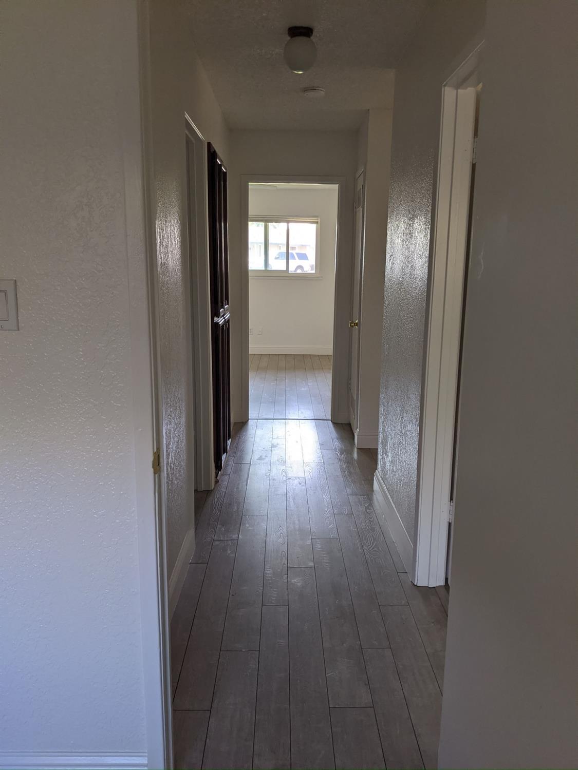5743 Haskell Avenue Carmichael, CA 95608 - Photo 46 of 47 wooden floor in a hall with wooden floor