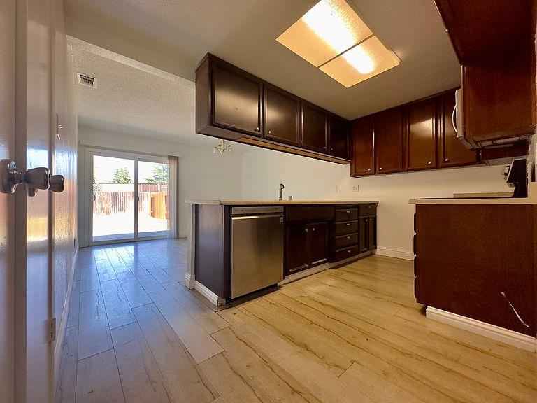 5743 Haskell Avenue Carmichael, CA 95608 - Photo 8 of 47 a kitchen with stainless steel appliances granite countertop a stove a sink and a refrigerator