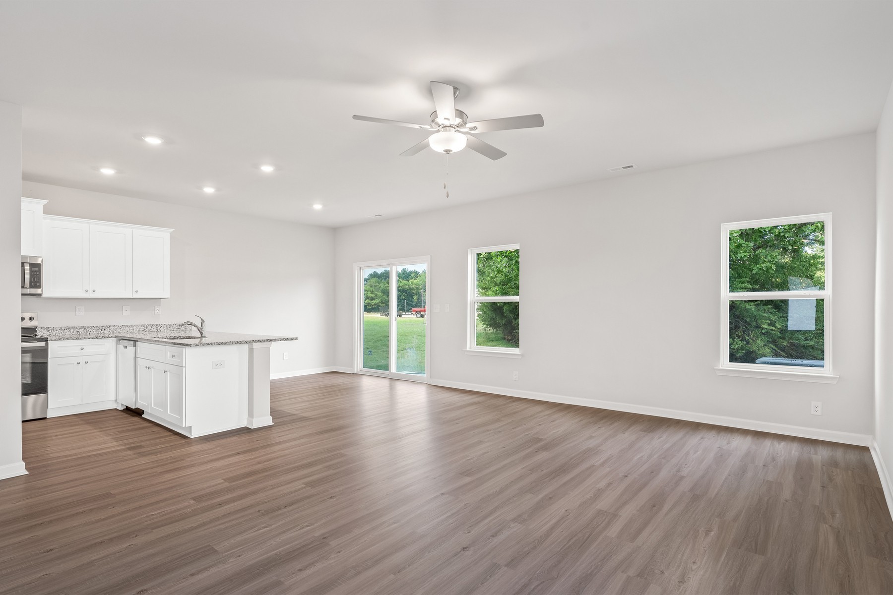 2034 Lala Loop White Bluff, TN 37187 - Photo 3 of 14 a view of an empty room with wooden floor and a window
