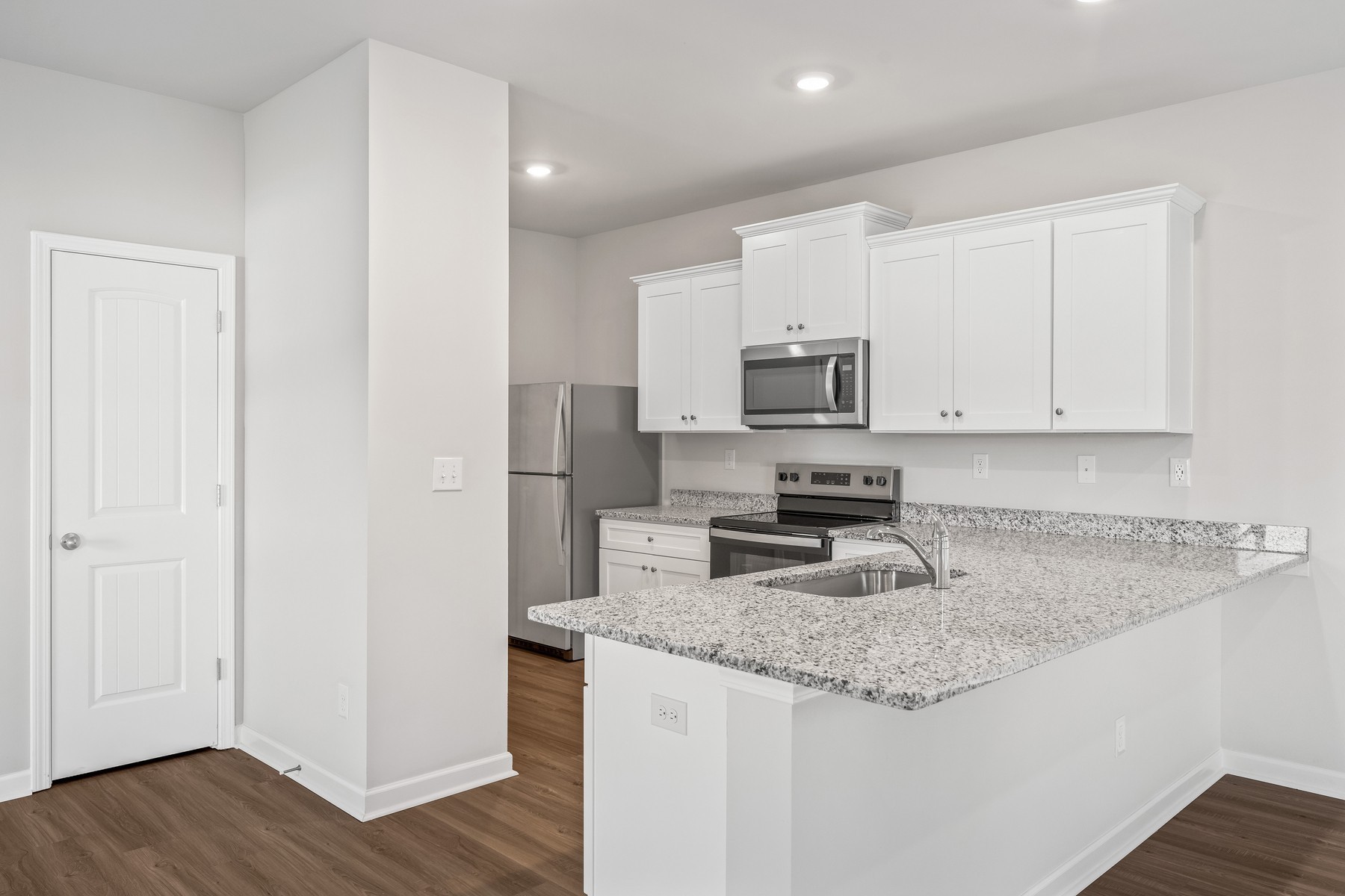 2034 Lala Loop White Bluff, TN 37187 - Photo 6 of 14 a kitchen with granite countertop a sink and steel appliances