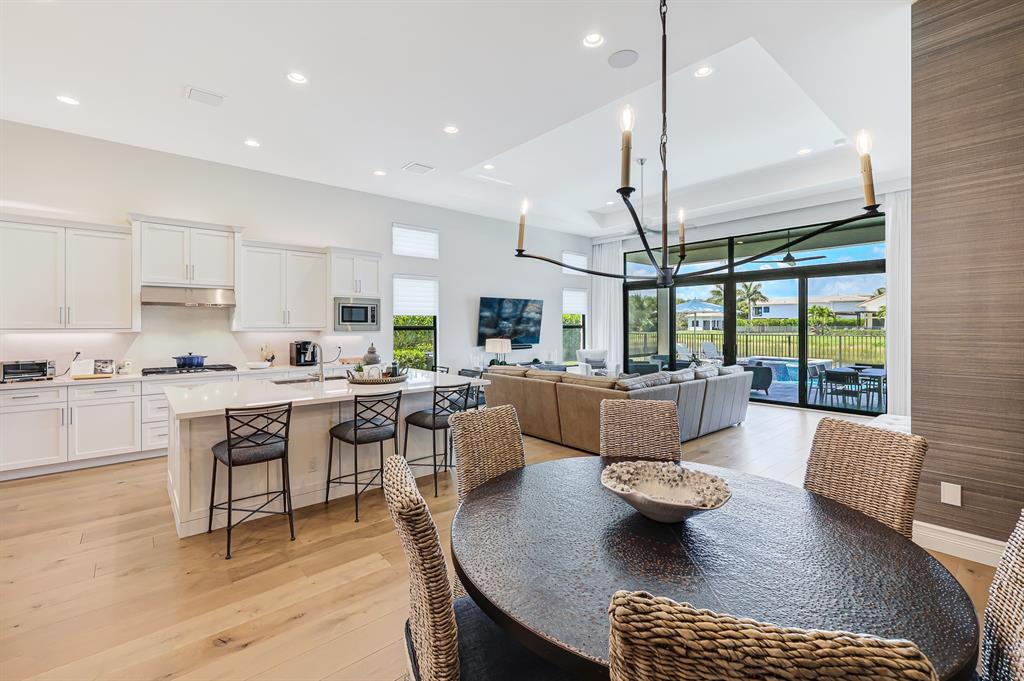 17401 Santaluce Manor Boca Raton, FL 33496 - Photo 11 of 84 a living room with furniture and a large window with kitchen view